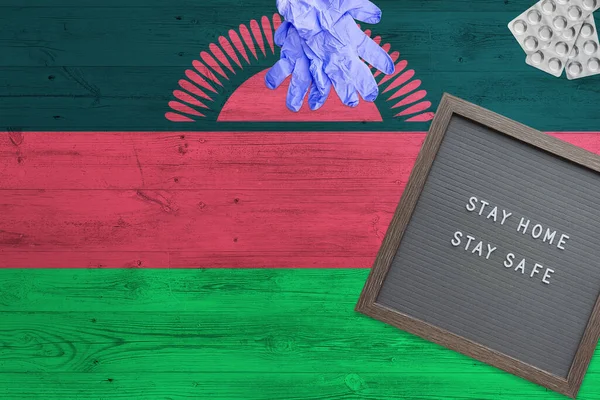 Fondo Bandera Malawi Sobre Mesa Madera Tablero Escritura Stay Home — Foto de Stock