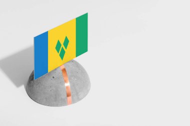 Aziz Vincent ve Grenadine bayrağı yuvarlak taşın üzerinde. Beyaz izole edilmiş arka plan. Yan görünüm asgari ulusal kavram.