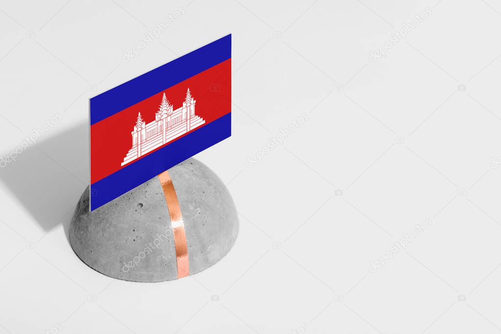 Cambodia flag tagged on rounded stone. White isolated background. Side view minimal national concept.