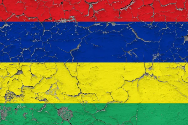 Mauritius flag close up grungy, damaged and weathered on wall peeling off paint to see inside surface. Vintage concept.