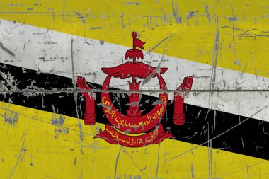 Çatlamış kirli yüzeye Brunei bayrağı boyanmış. Klasik stil yüzeyinde ulusal model. Çizilmiş ve yıpranmış konsept.