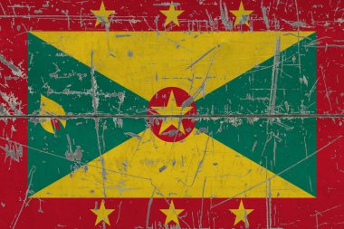 Çatlak kirli yüzeye Grenada bayrağı çizilmiş. Klasik stil yüzeyinde ulusal model. Çizilmiş ve yıpranmış konsept.