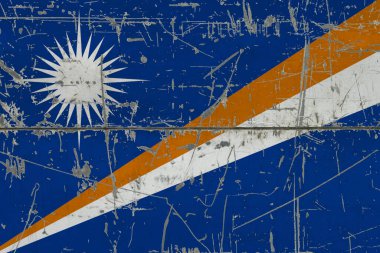 Marshall Adaları bayrağı çatlak kirli yüzeye boyanmış. Klasik stil yüzeyinde ulusal model. Çizilmiş ve yıpranmış konsept.