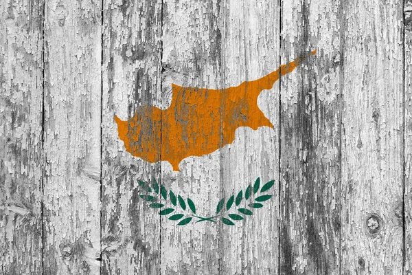 Cyprus flag on grunge scratched wooden surface. National vintage background. Old wooden table scratched flag surface.