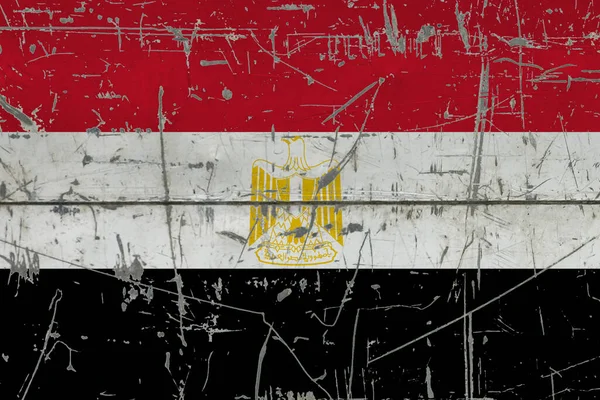 Egypt flag painted on cracked dirty surface. National pattern on vintage style surface. Scratched and weathered concept.