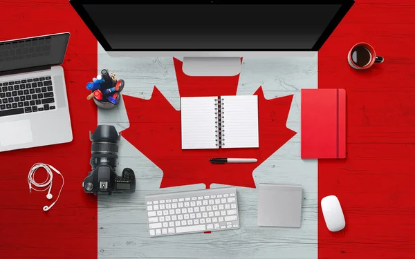 Canada Flag Background Headphone Camera Notebook Mouse National Office Desk — стоковое фото