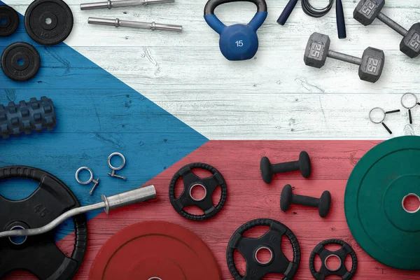 Çek Cumhuriyeti Spor ve Spor Konsepti. Ulusal arkaplanda demir çubuk bulunan ağır ağırlık plakalarının üst görünümü.