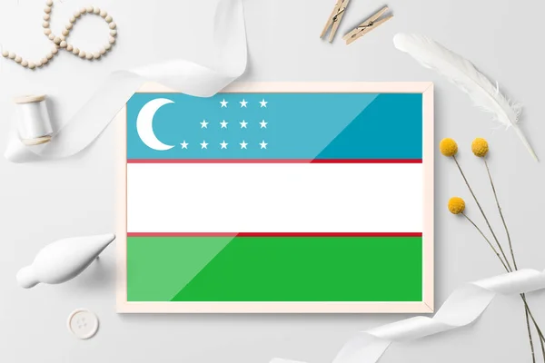 Uzbekistan Flag Wooden Frame White Creative Background White Theme Feather — Stock Photo, Image