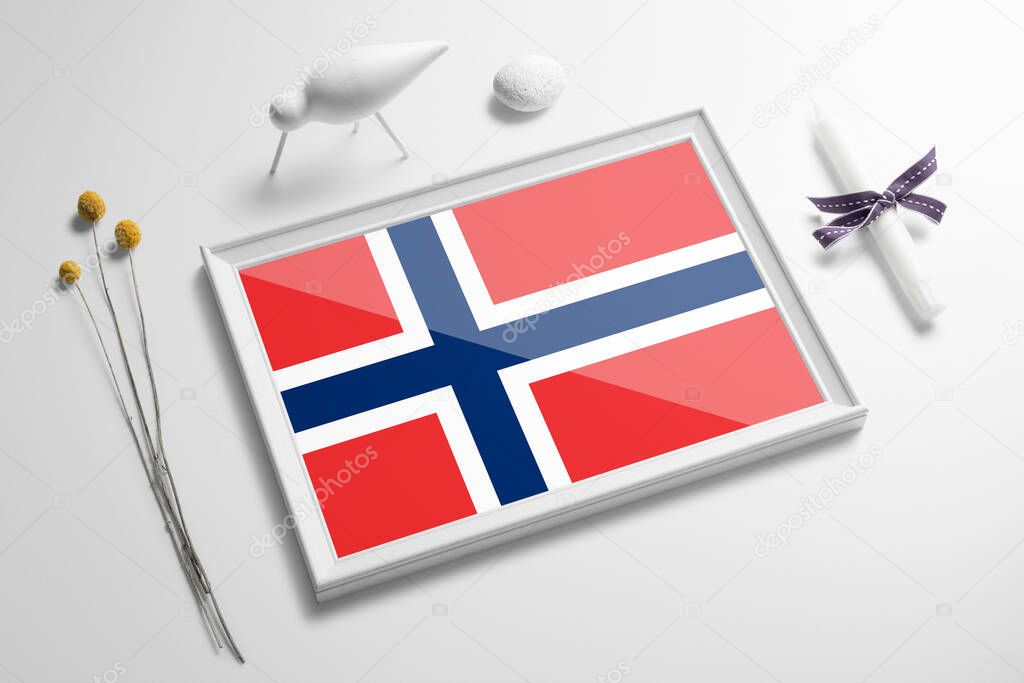 Norway flag in wooden frame on table. White natural soft concept, national celebration theme.