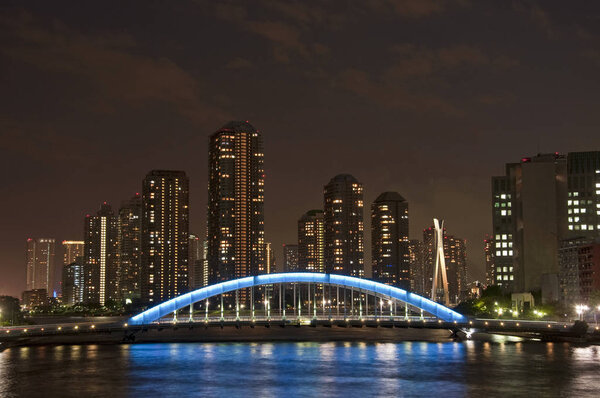 The ngiht lights reflecting on the Sumida River, Tokyo, Japan.