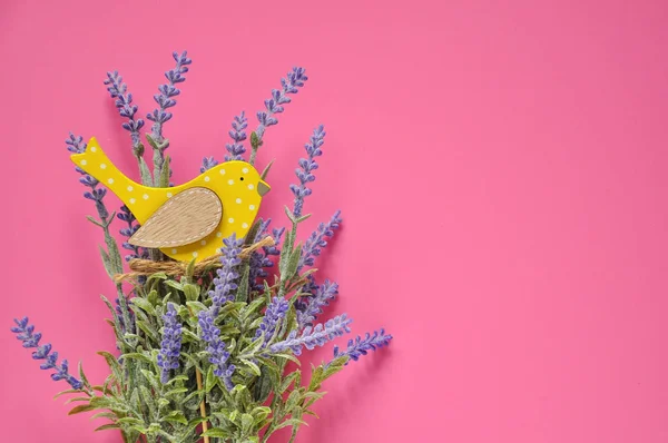 Bouquet of lavender and yellow bird background.