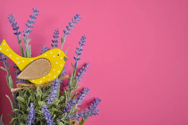 Bouquet of lavender and yellow bird background.