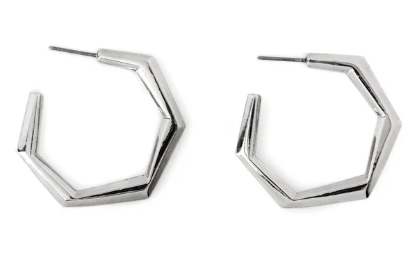 Hexagonal-shaped Silver Hoop Earrings isolated on white.