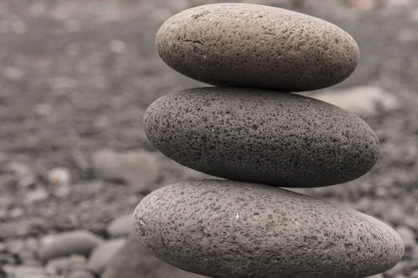 Three round rocks piled up