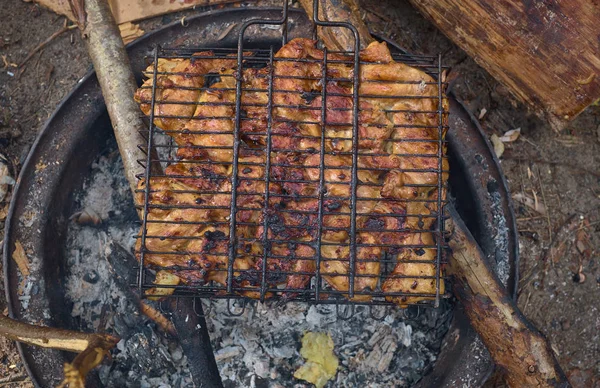 Shashlik or shashlyk preparing Meat on skewers is roasted on fire