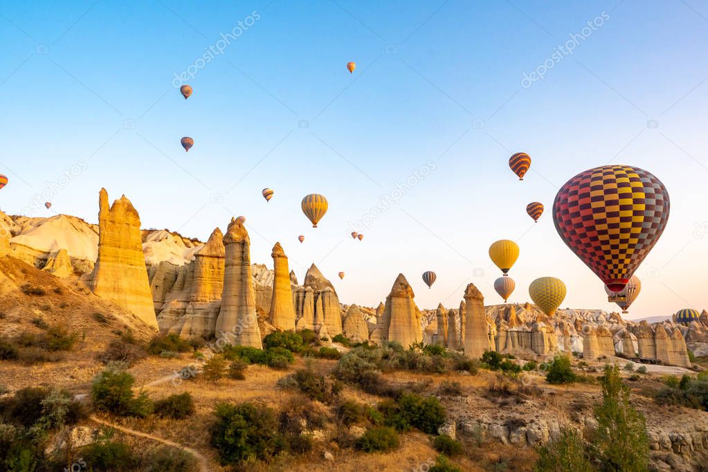 balloons on a background of mountains and dawn in Cappadocia