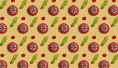 Sarı arka planda domates deseni. Fesleğen ve pembe domates.