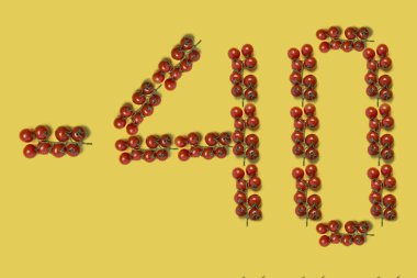 Domates yazı tipi numaralar. Üst Manzara. Sarı arka planda vişneli domates yazısı -40. Reklam kavramı 