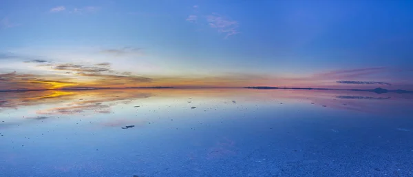 Uyuni reflections. One of the most amazing things that a photographer can see. Here we can see how the sunrise over an infinite horizon with the Uyuni salt flats making a wonderful mirror to infinity