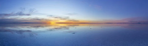 Uyuni reflections. One of the most amazing things that a photographer can see. Here we can see how the sunrise over an infinite horizon with the Uyuni salt flats making a wonderful mirror to infinity