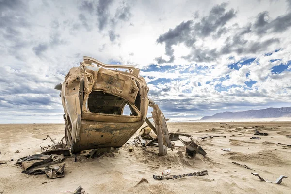 Still visible the effects of the 2015 flooding in North Chile at Chaaral beach. A car remains abandoned above the ground, rusty by the aggressive environment in the outdoors at Atacama Desert, Chile