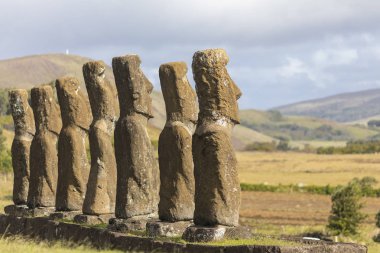 Ahu Akivi, the only Ahu platform on Easter Island looking to the Pacific Ocean. 7 moais still stand up at the center of the Island. Ahu Akivi reveals the Moais magic clipart