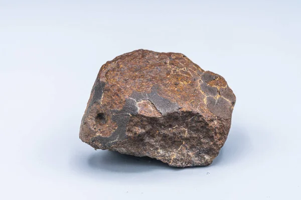 Meteoritenstück Auf Hintergrund — Stockfoto