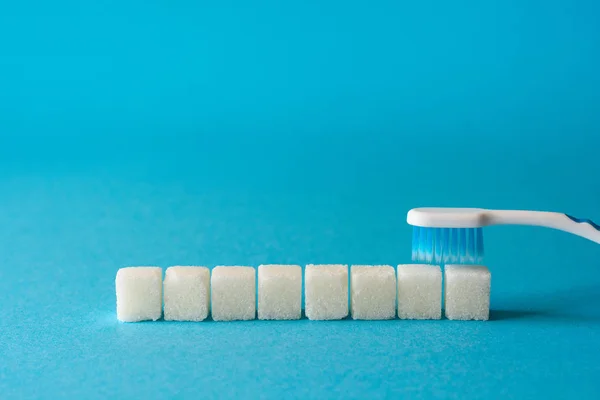 Brushing Teeth Toothbrush Cleans Dirt Teeth Sugar Cubes Sesame Seeds — Stock Photo, Image