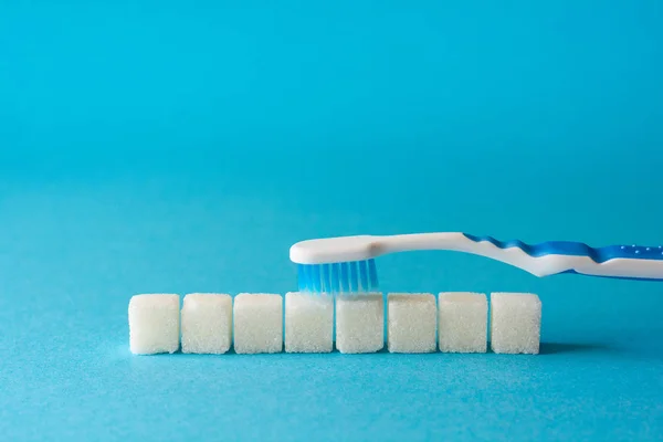 Brushing Teeth Toothbrush Cleans Dirt Teeth Sugar Cubes Sesame Seeds — Stock Photo, Image