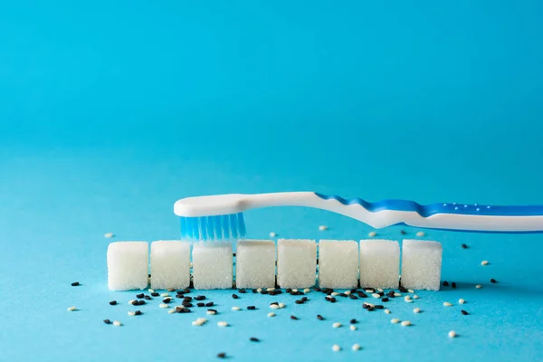 Brushing Teeth Toothbrush Cleans Dirt Teeth Sugar Cubes Sesame Seeds — Stock Photo, Image