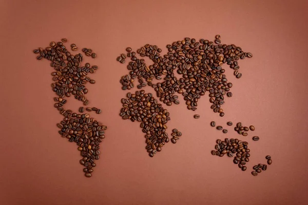 Weltkarte Aus Gerösteten Kaffeebohnen Auf Braunem Papiergrund Internationale Kaffeeindustrie Oder — Stockfoto
