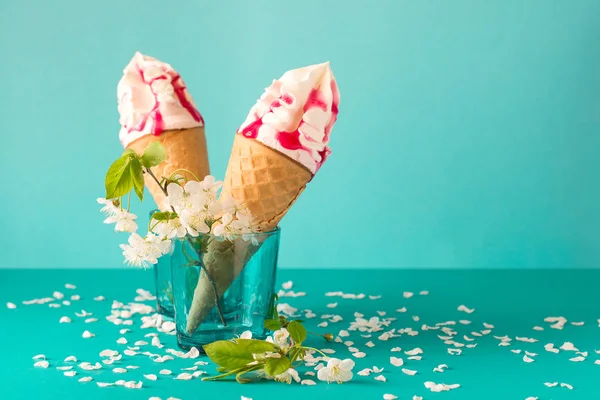 Melting Ice Cream Cone Fruit Syrup Decorated White Cherry Blossom — Stock Photo, Image