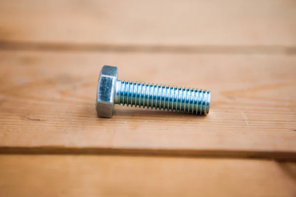 One Bolts Wooden Background — Stock Photo, Image