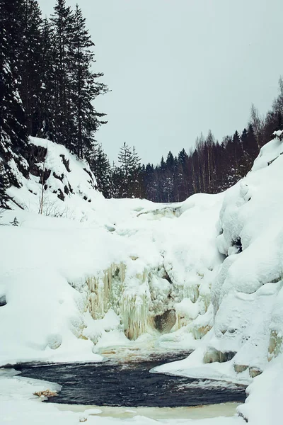 Winter landscape with waterfall