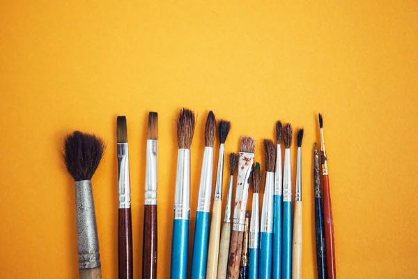 Set Paint Brushes Yellow Background — Stock Photo, Image