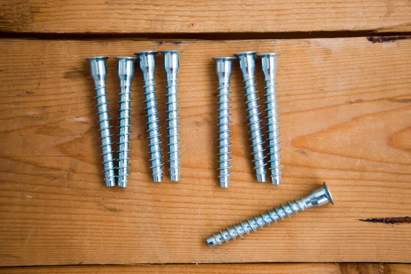 Set Metalware Bolts Wooden Background — Stock Photo, Image