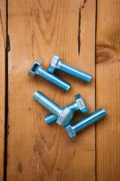 Set Metalware Bolts Wooden Background — Stock Photo, Image