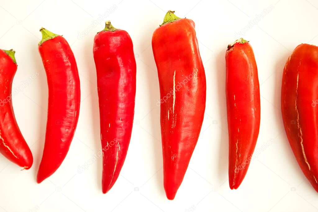 Set of red peppers on white background