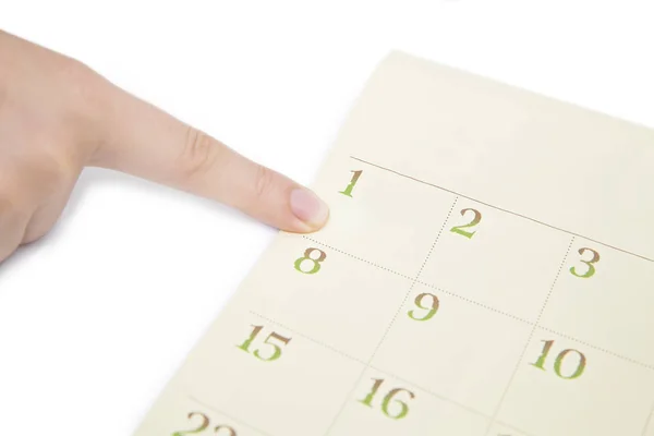 Vrouwelijke Vinger Weergegeven Datum Een Kalender Witte Achtergrond Nummer Kalender — Stockfoto