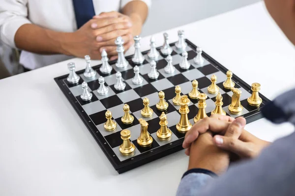 Business people playing chess and thinking about strategy crash overthrow the opposite team and development analysis for win and successful.