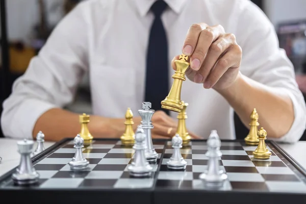 Planning and Strategic concept, Businessman playing chess and thinking strategy about crash overthrow the opposite team and development analysis for win and successful.
