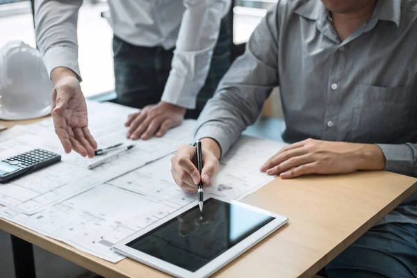 Construction engineering or architect discussing a blueprint and — Stock Photo, Image