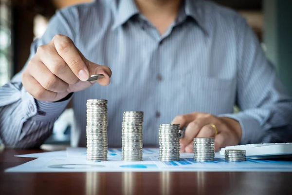 Businessman accountant counting money and making notes at report — Stock Photo, Image