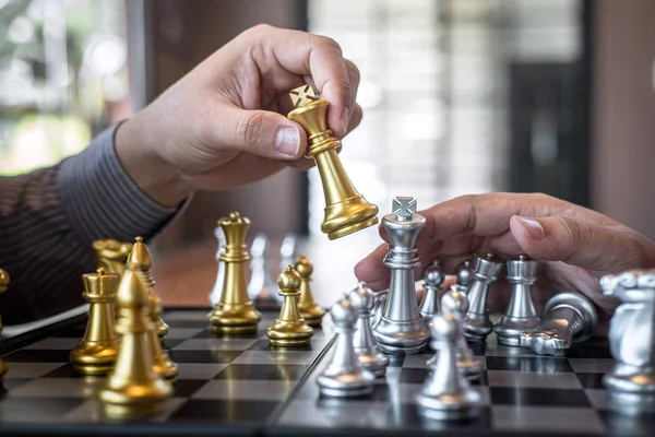 Intelligent businessman playing chess game competition with the — Stock Photo, Image