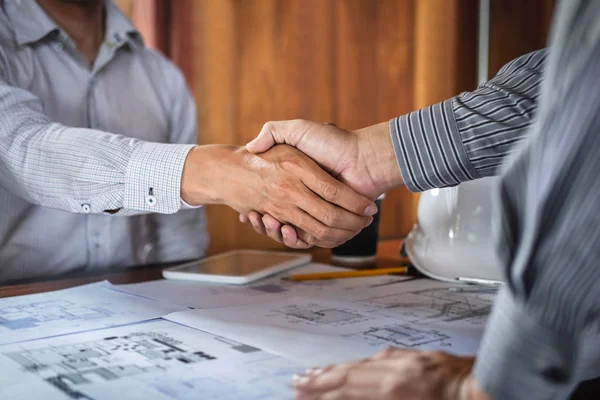 Handshake of collaboration, Construction engineering or architec