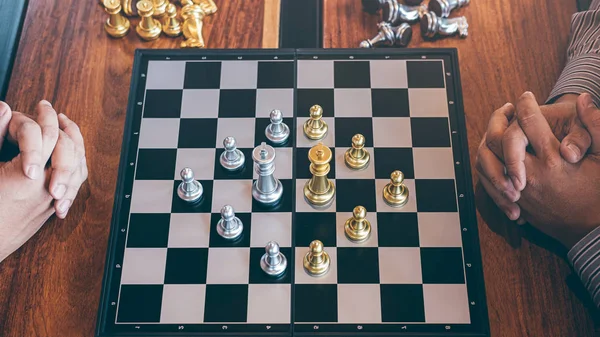 Chess game on chess board behind business man background. Business concept  to present financial information and marketing strategy analysis. Investmen  Stock Photo - Alamy