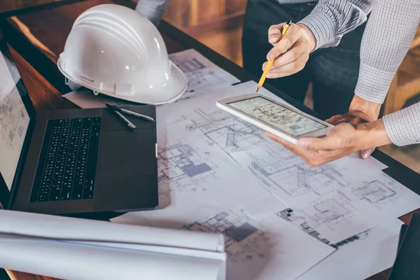 Construction engineering or architect discussing a blueprint and — Stock Photo, Image