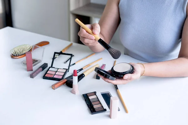 Elegant female Beauty blogger showing testing beauty cosmetic us
