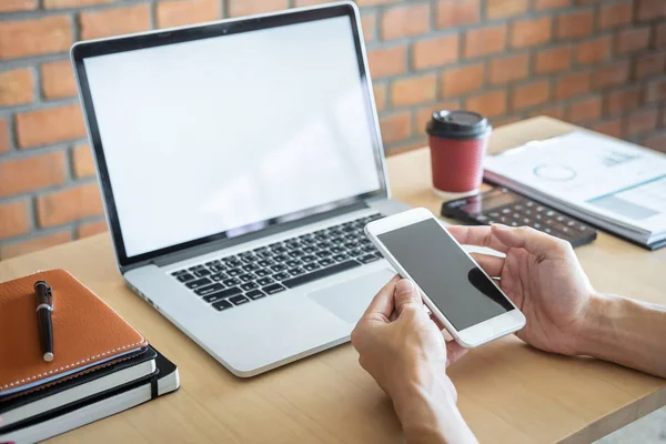 Image of Young man working in front of the laptop looking at scr