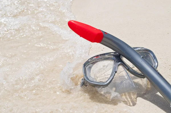 Diving goggles and snorkel at the beach